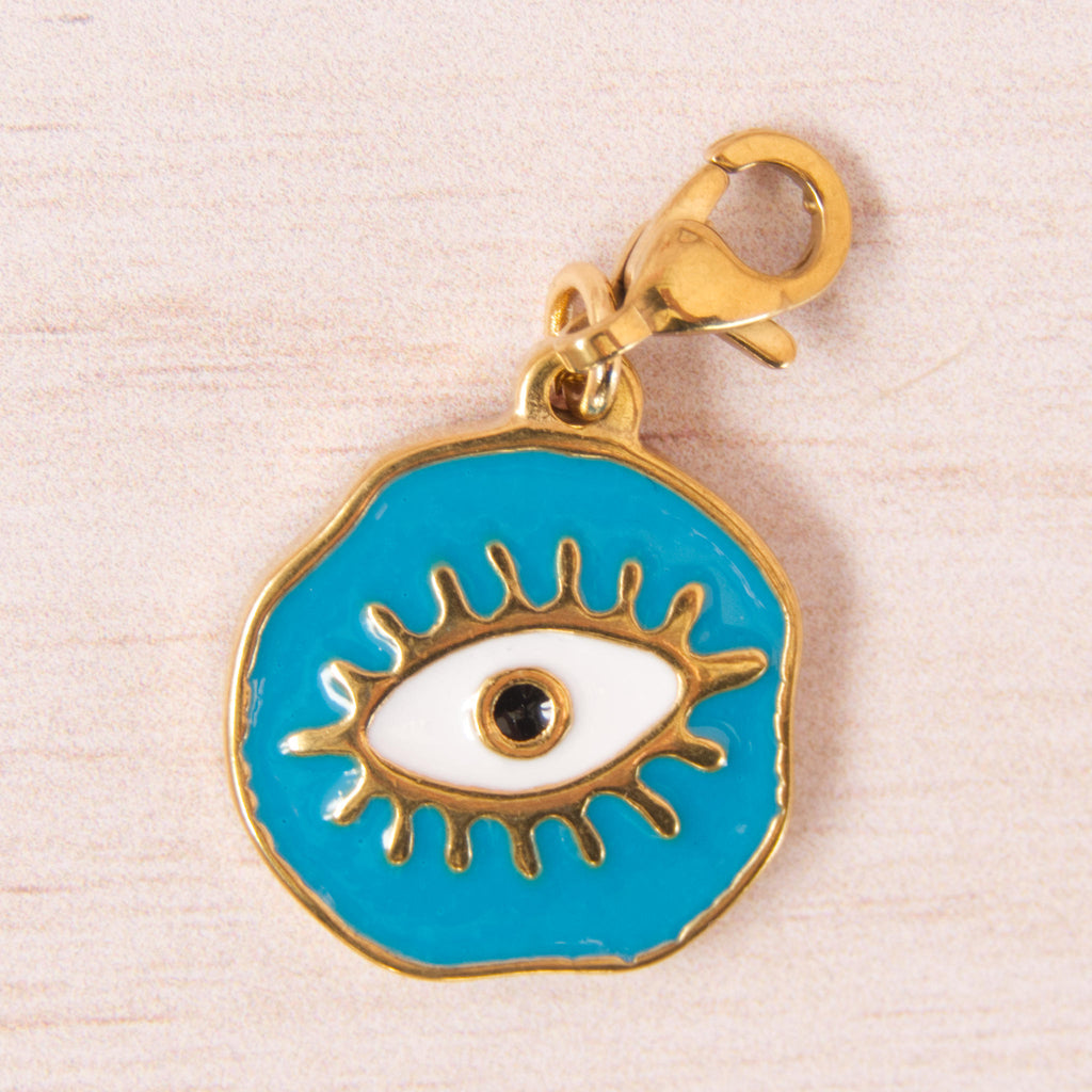 médaille oeil bleu doré